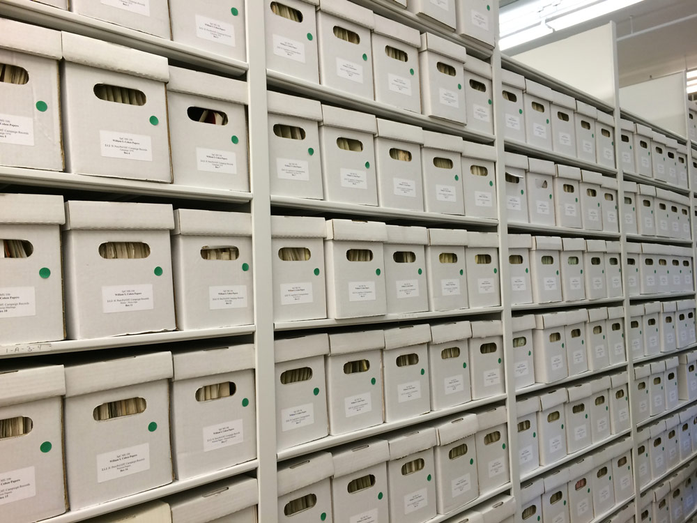 White shelf filled with boxes.